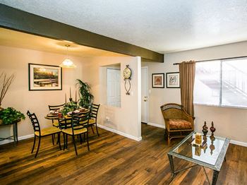 Dining area & living room at tierra pointe apartments in Albuquerque, nm